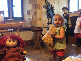 Young child playing in the children's area of the museum.